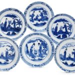 A SET OF SIX BLUE AND WHITE 'LADIES AND FLOWERS' SAUCER DISHES. KANGXI PERIOD