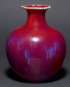 Vase; pomegranate form. Made of flambe glazed porcelain
