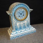 A late 19th Century blue and white ceramic mantle clock in the Arts & Crafts manner