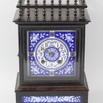 An ebonised mantel clock, of Arts & Crafts style