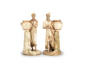 A rare pair of Royal Worcester figures of African water carriers, dated 1887-88