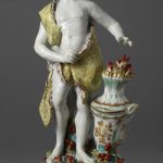 Figure of 'Winter', soft-paste porcelain, decorated in enamel colours.