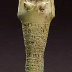 AN EGYPTIAN FAIENCE SHABTI FOR NEFERIBRE-SANEITH LATE PERIOD, 26TH DYNASTY, CIRCA 6TH CENTURY B.C.