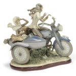 A 'MOTORCYCLE WITH SIDECAR' CERAMIC FIGURINE GROUP BY LLADRO, 1982-1985